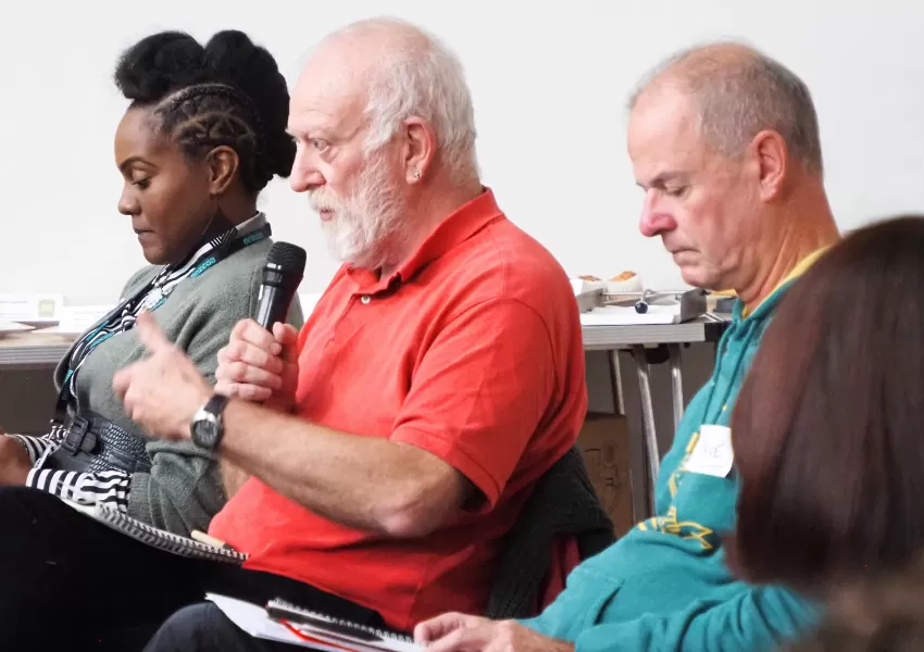 audience member asking a question into the microphone