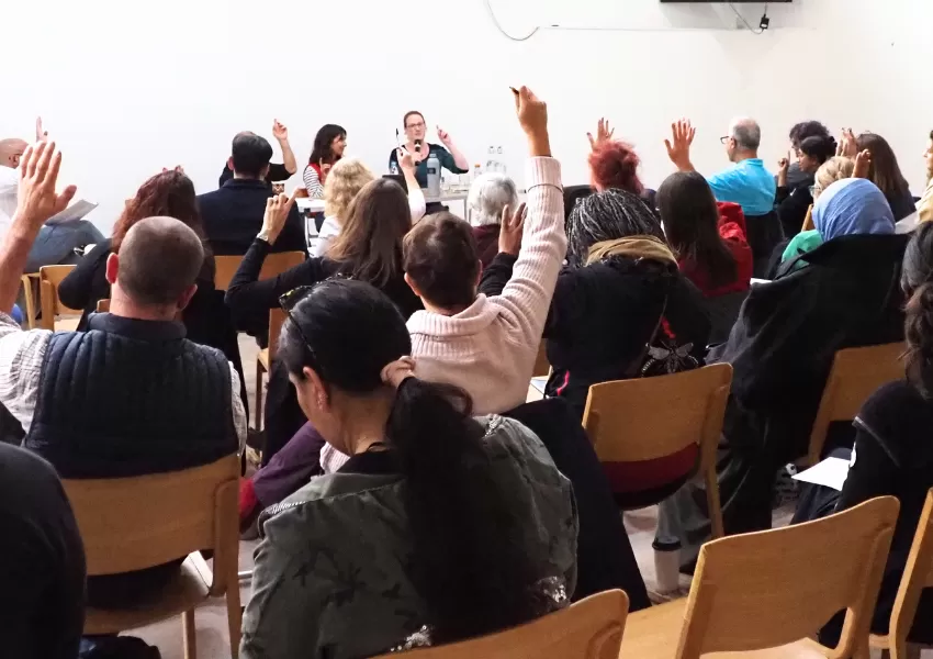 audience raising hands at food summit