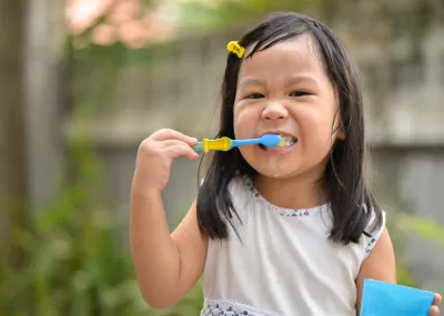 Girl brushing her teeth