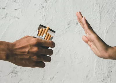 A person refuses the offer of a cigarette