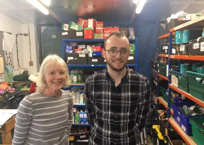 Two volunteers sorting food donations at Chipping Barnet Food bank