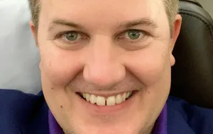 Photo of Adam smiling