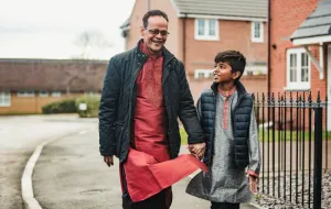 A father and son walking to school