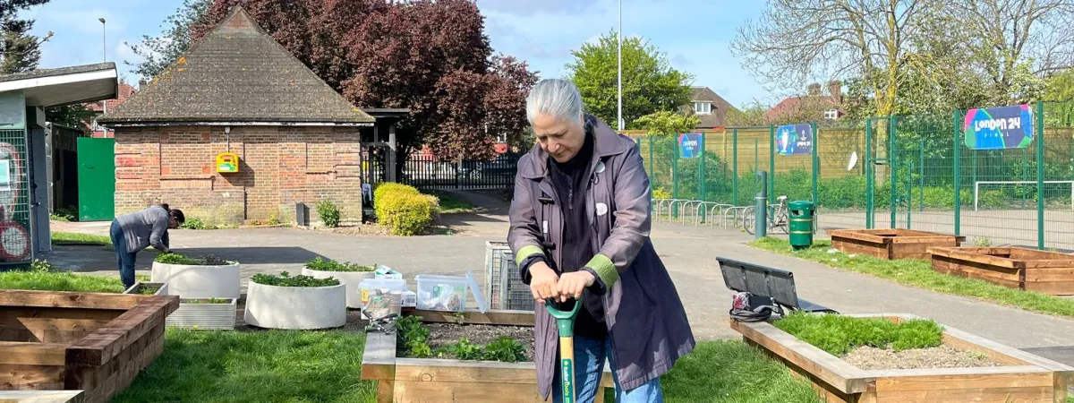 one person gardening in a park 