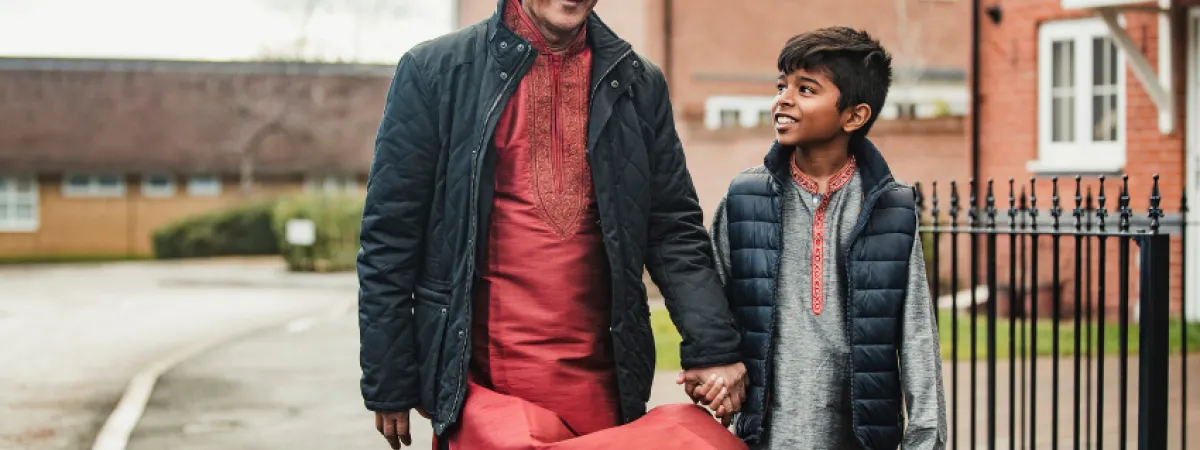 A father and son walking to school